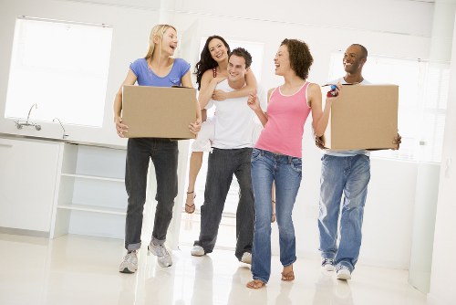 Local removals team planning a move in Belsize Park street with narrow access