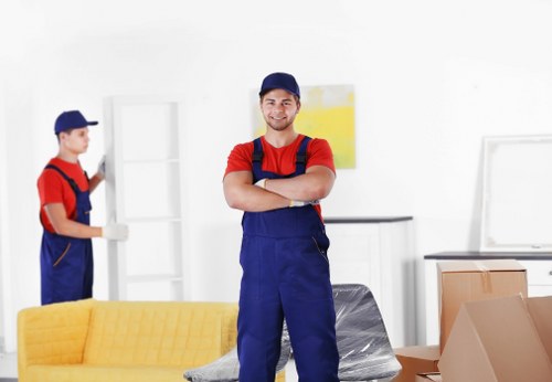 Furniture removals team handling household items in Belsize Park