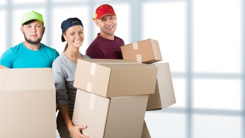 Trained moving staff using careful lifting techniques and safety procedures