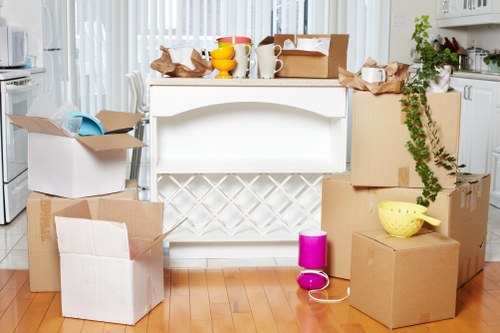 Carefully wrapped furniture and boxes for a move in Belsize Park
