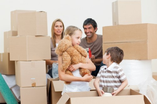 Packed boxes and furniture ready for local flat removals